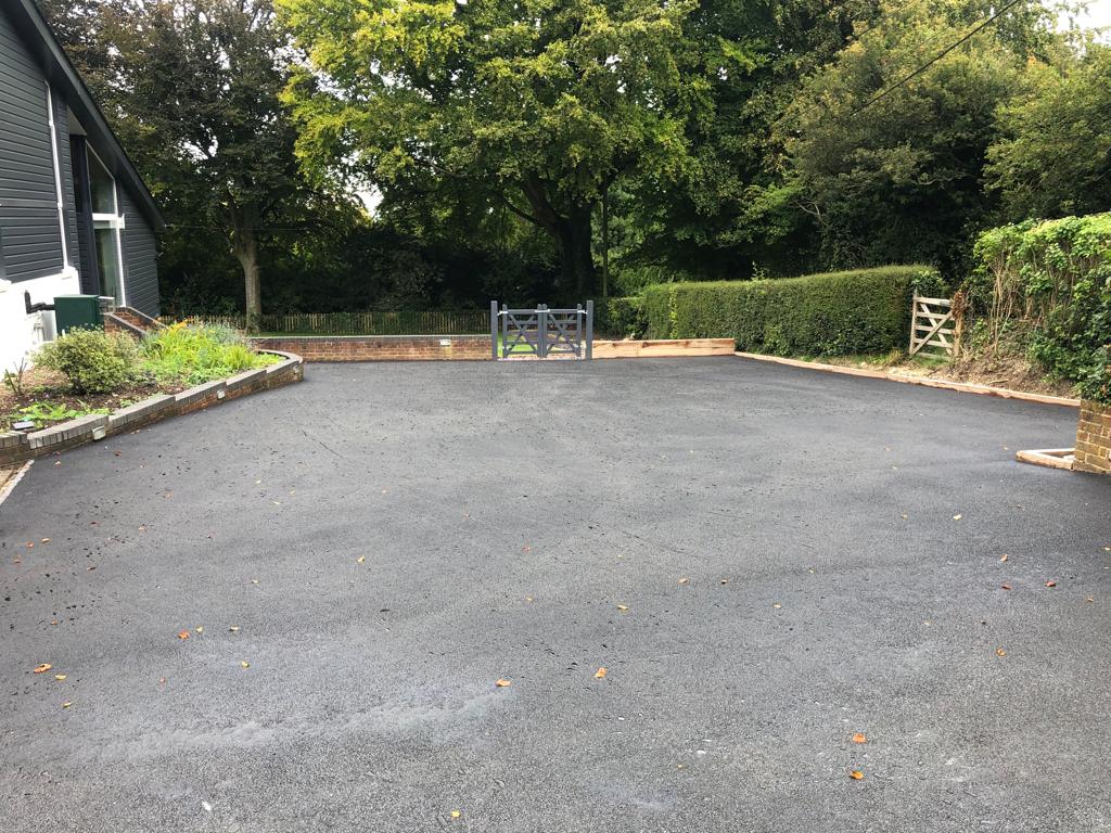 This is a photo of a bitumen driveway which is in the process of being installed by Toowoomba Asphalt & Bitumen Surfacing
